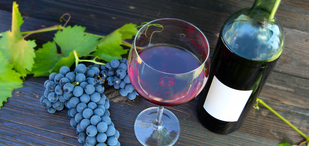 red wine with bottle and grapes
