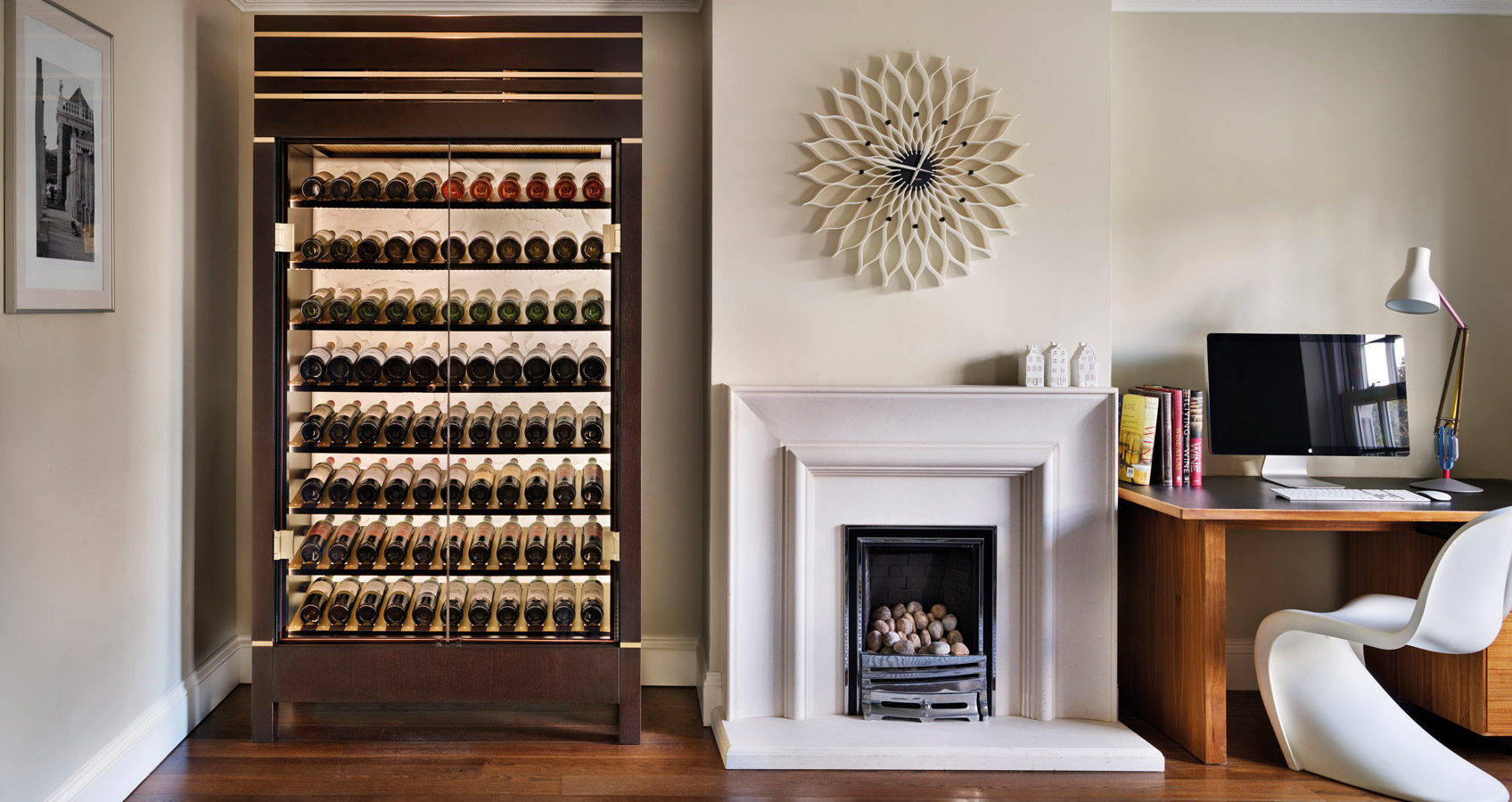 a wine cabinet shown in situ in a well lit study