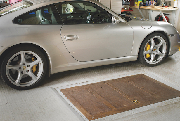 Reinforced trap door for garage use