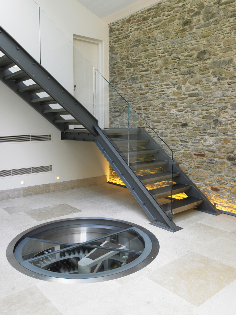 Retractable round glass trap door - hallway