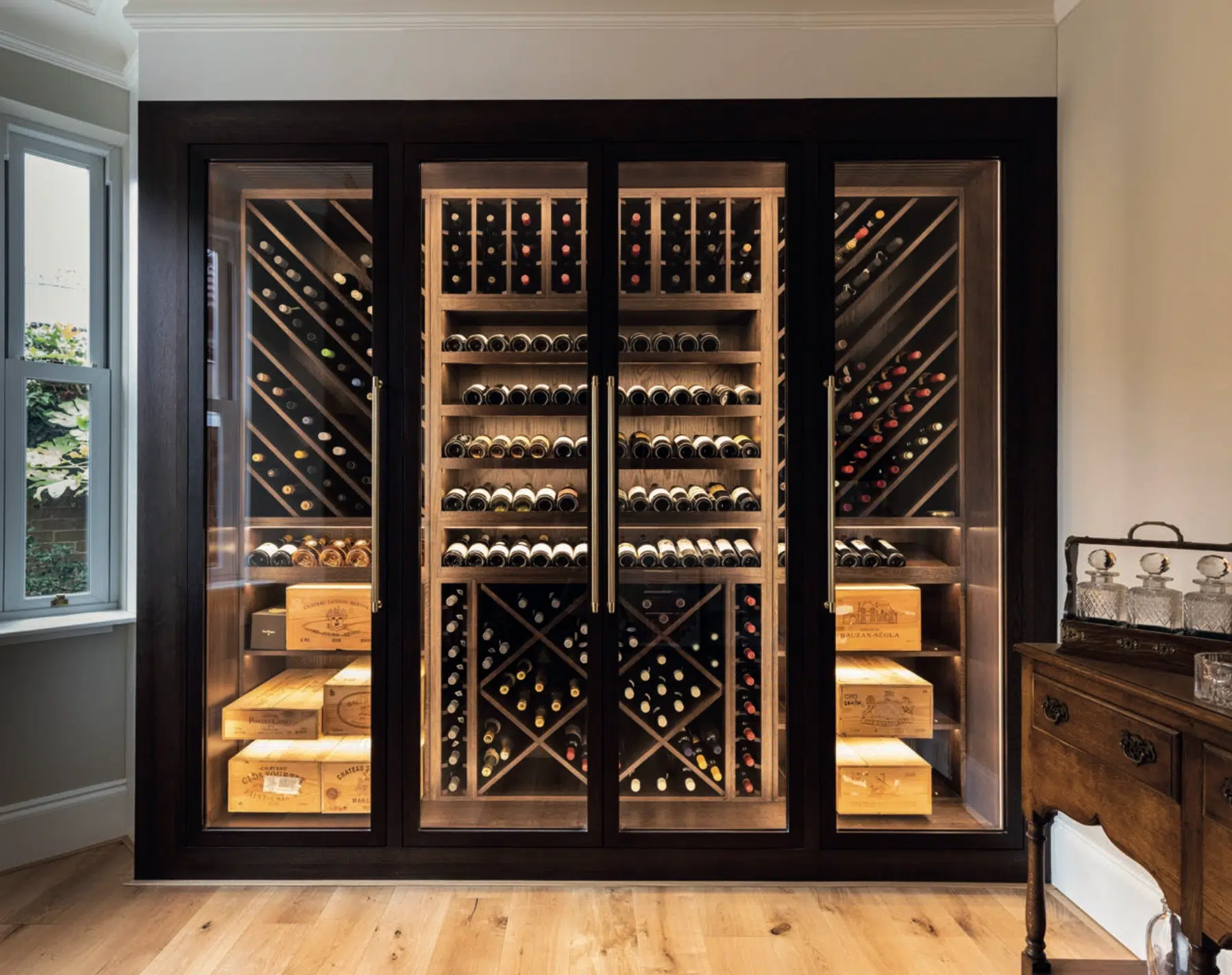 a custom wine cabinet with built in lighting shown in situ